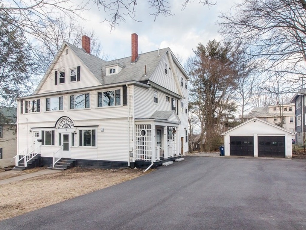 8-10 Allston Street Newton, MA 02465 - Photo 1 of 42 a front view of a house with a road
