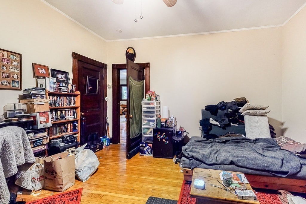 8-10 Allston Street Newton, MA 02465 - Photo 17 of 42 a living room with furniture and a book shelf