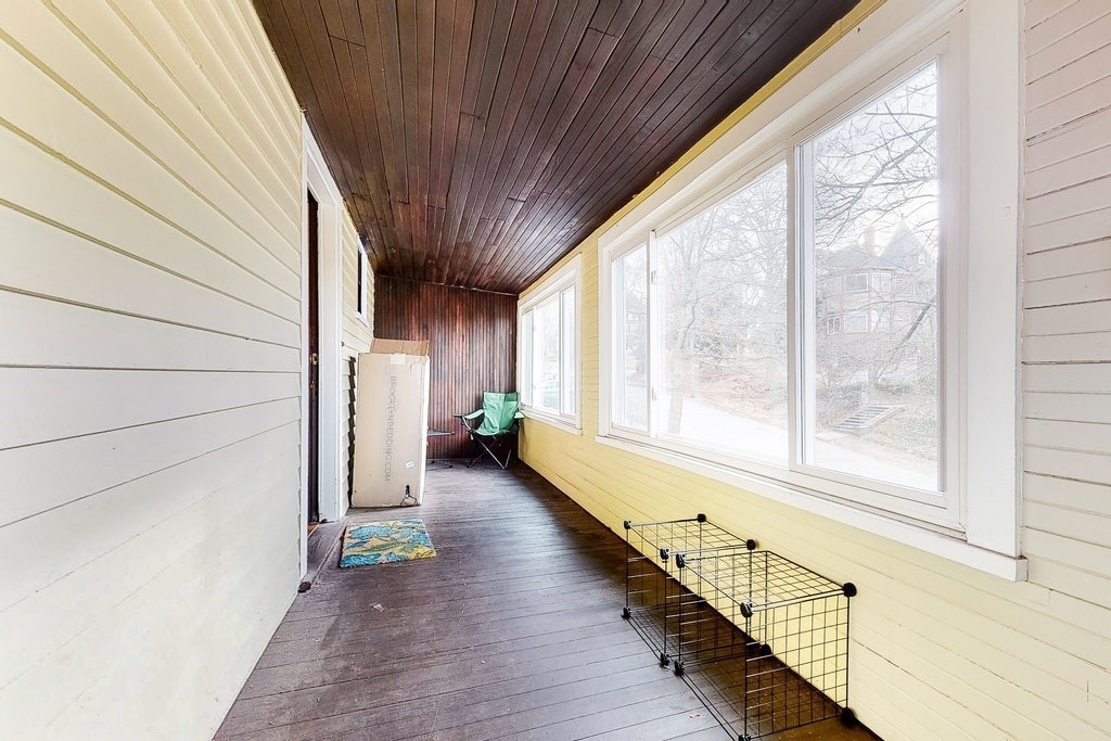 8-10 Allston Street Newton, MA 02465 - Photo 18 of 42 a view of a room with wooden floor and windows