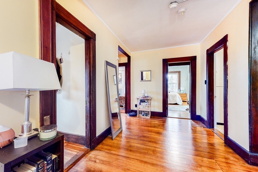 8-10 Allston Street Newton, MA 02465 - Photo 19 of 42 a living room with furniture window and wooden floor