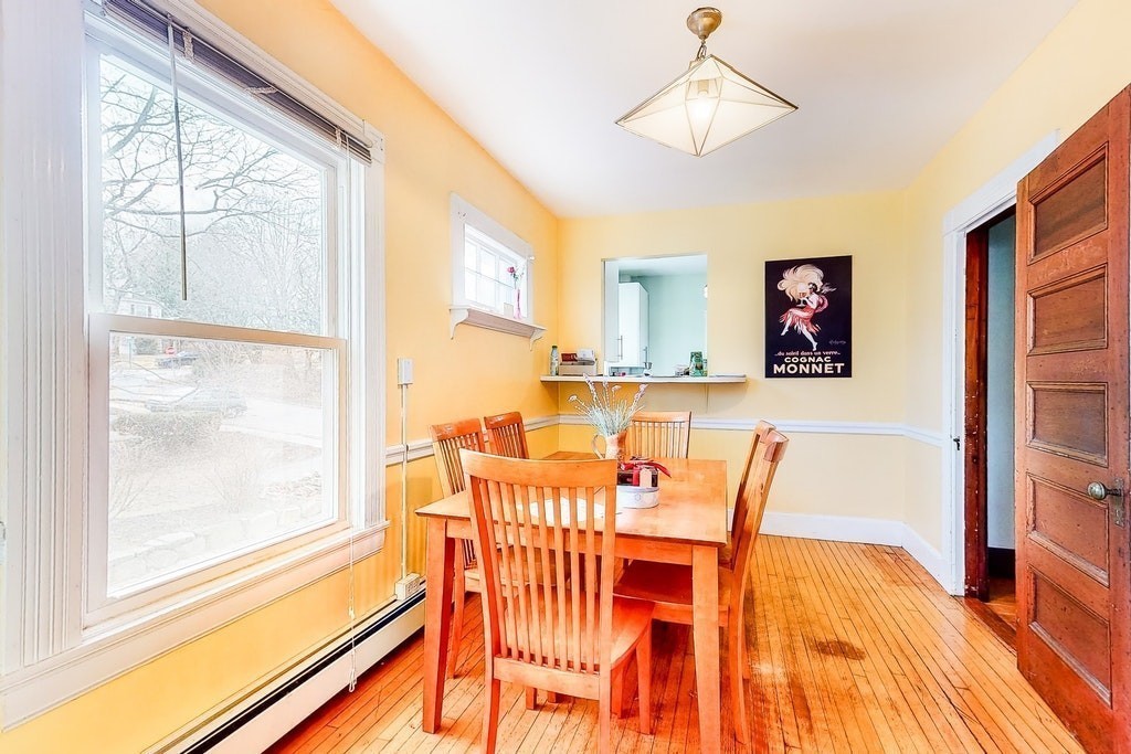 8-10 Allston Street Newton, MA 02465 - Photo 21 of 42 a view of a dining room with furniture window and wooden floor