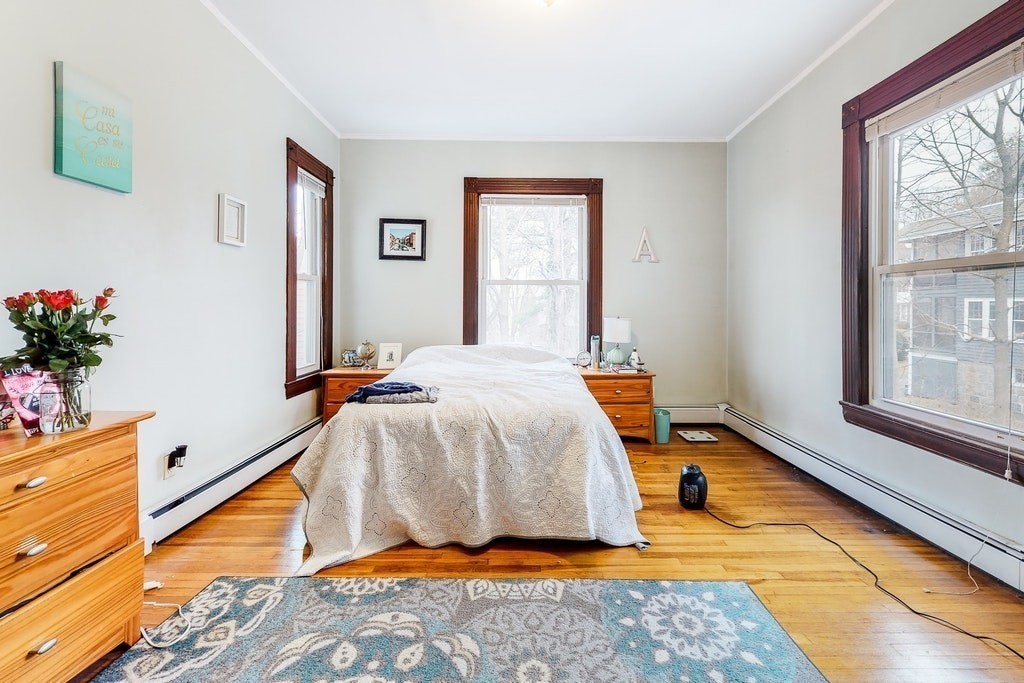 8-10 Allston Street Newton, MA 02465 - Photo 28 of 42 a bedroom with a bed and a window