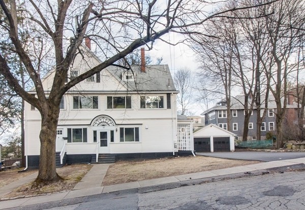 8-10 Allston Street Newton, MA 02465 - Photo 3 of 42 a white house that has a tree in front of it