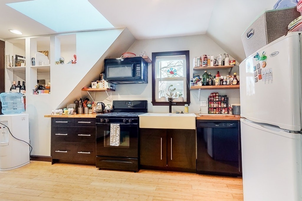8-10 Allston Street Newton, MA 02465 - Photo 34 of 42 a kitchen with stainless steel appliances granite countertop a refrigerator and a stove