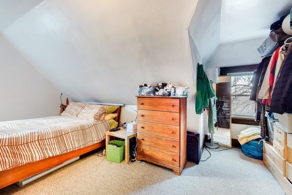 8-10 Allston Street Newton, MA 02465 - Photo 39 of 42 a bedroom with a bed and a wooden floor