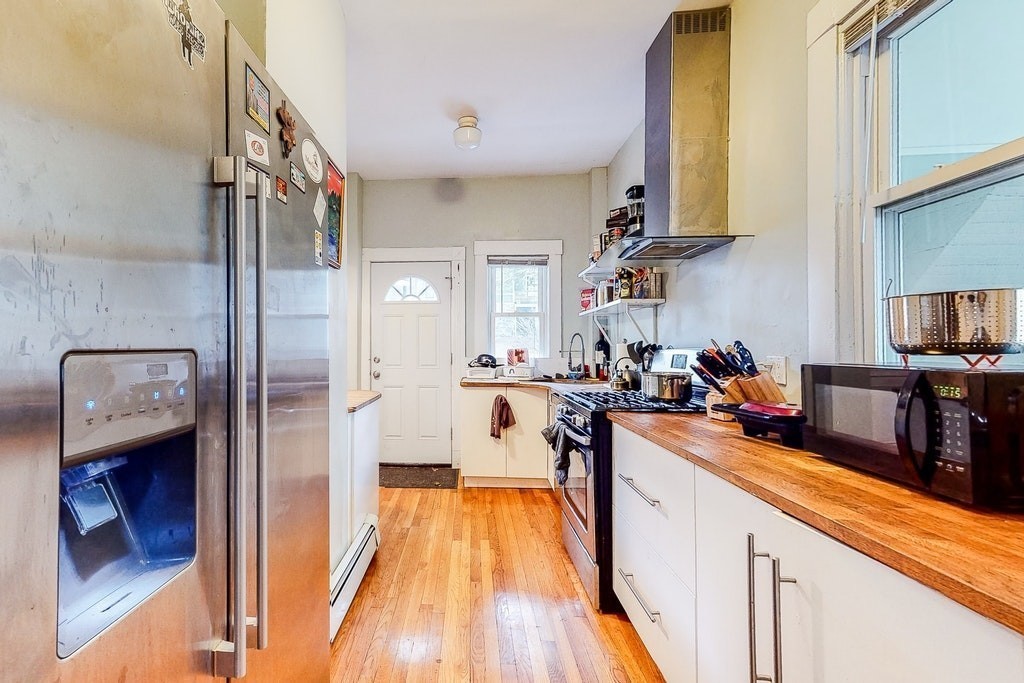 8-10 Allston Street Newton, MA 02465 - Photo 7 of 42 a view of a kitchen and dining room