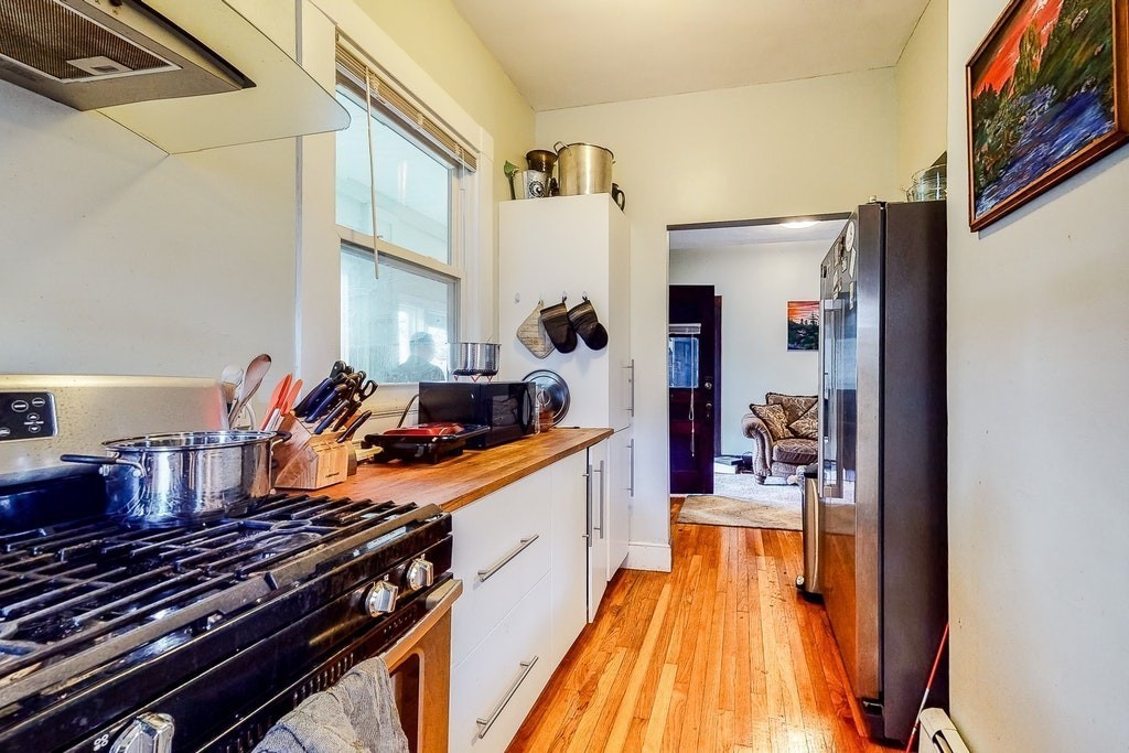 8-10 Allston Street Newton, MA 02465 - Photo 8 of 42 a kitchen view of a stove and a refrigerator