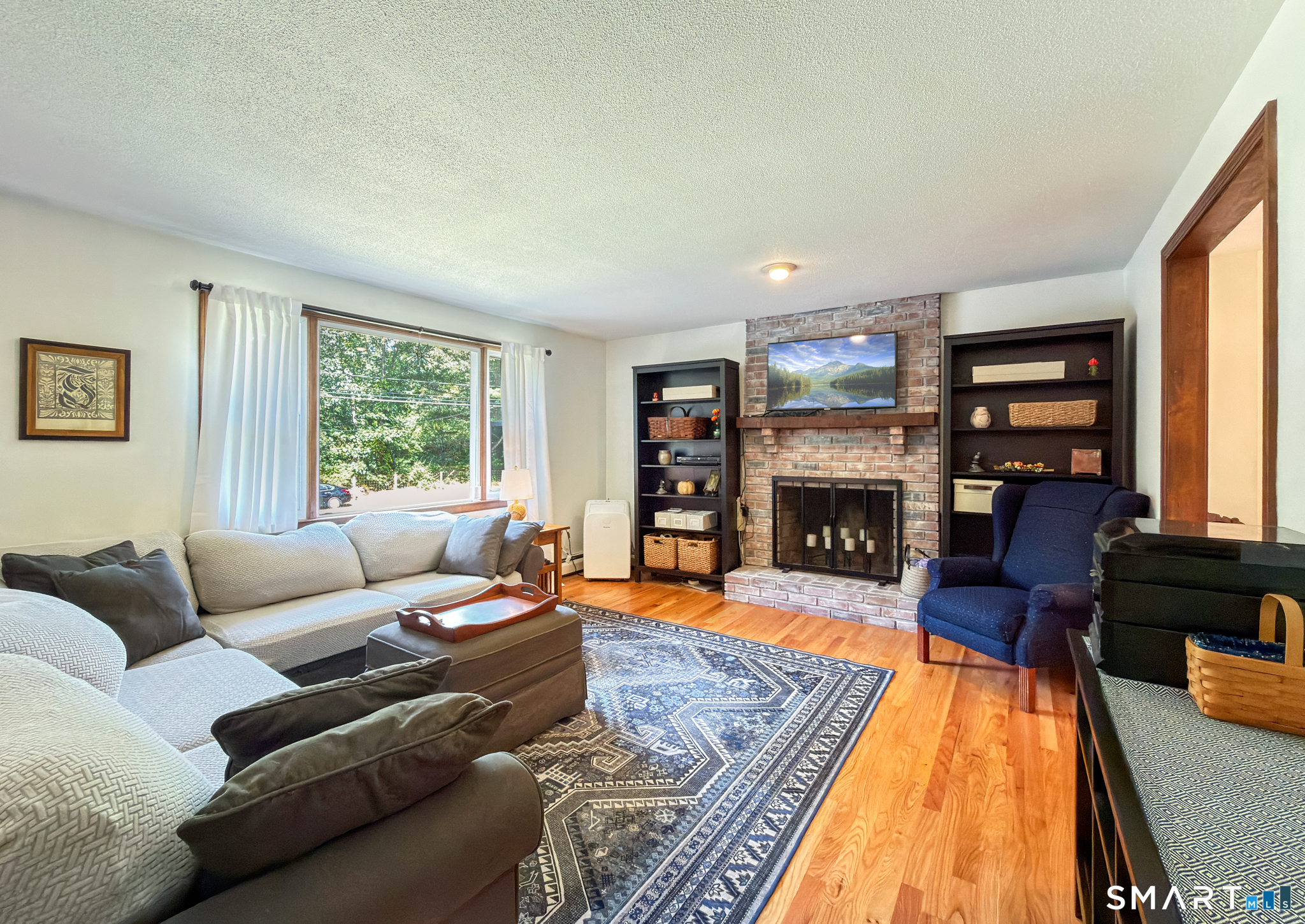 5 Rio Road Burlington, CT 06013 - Photo 13 of 40 Formal living room with fireplace