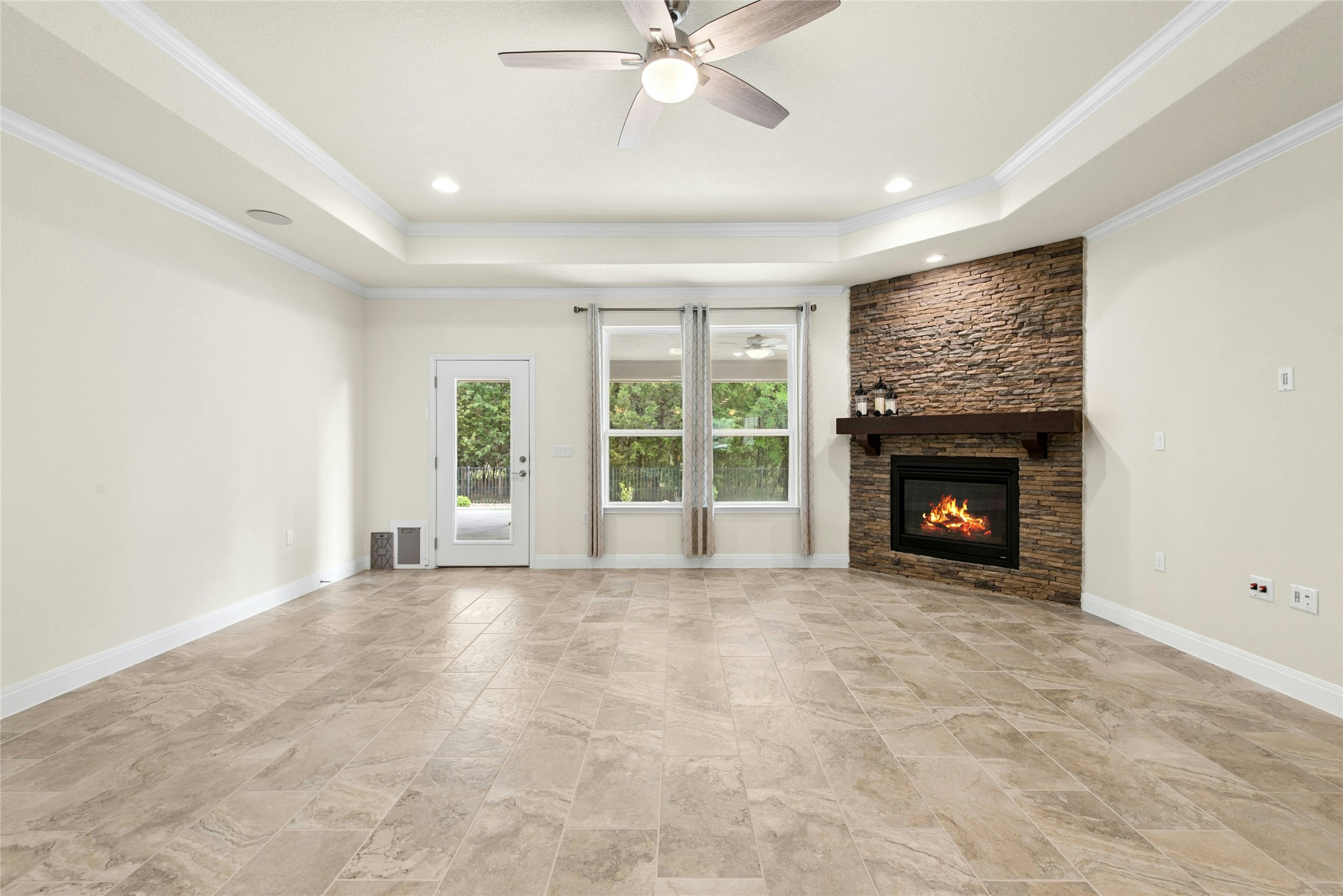 105 Marfa Cove Georgetown, TX 78633 - Photo 8 of 36 a view of an empty room with a fireplace and a window