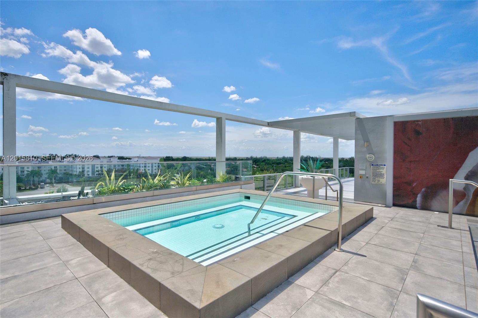 2000 Metropica Way, Unit 1902 Sunrise, FL 33323 - Photo 32 of 40 a view of a patio with a table and chairs