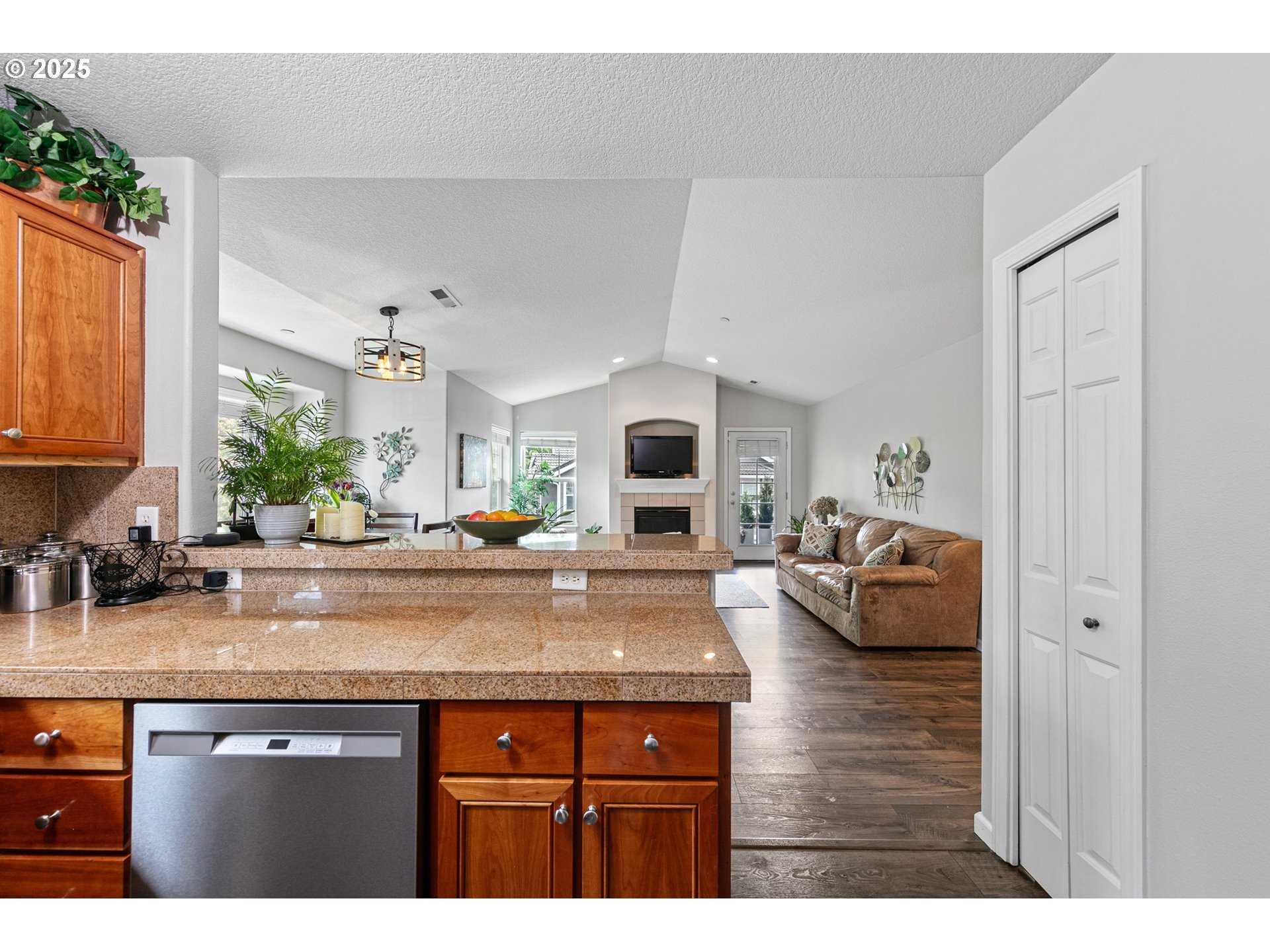 30366 Southwest Ruth Street, Unit 70 Wilsonville, OR 97070 - Photo 18 of 46 a kitchen with sink and view living room