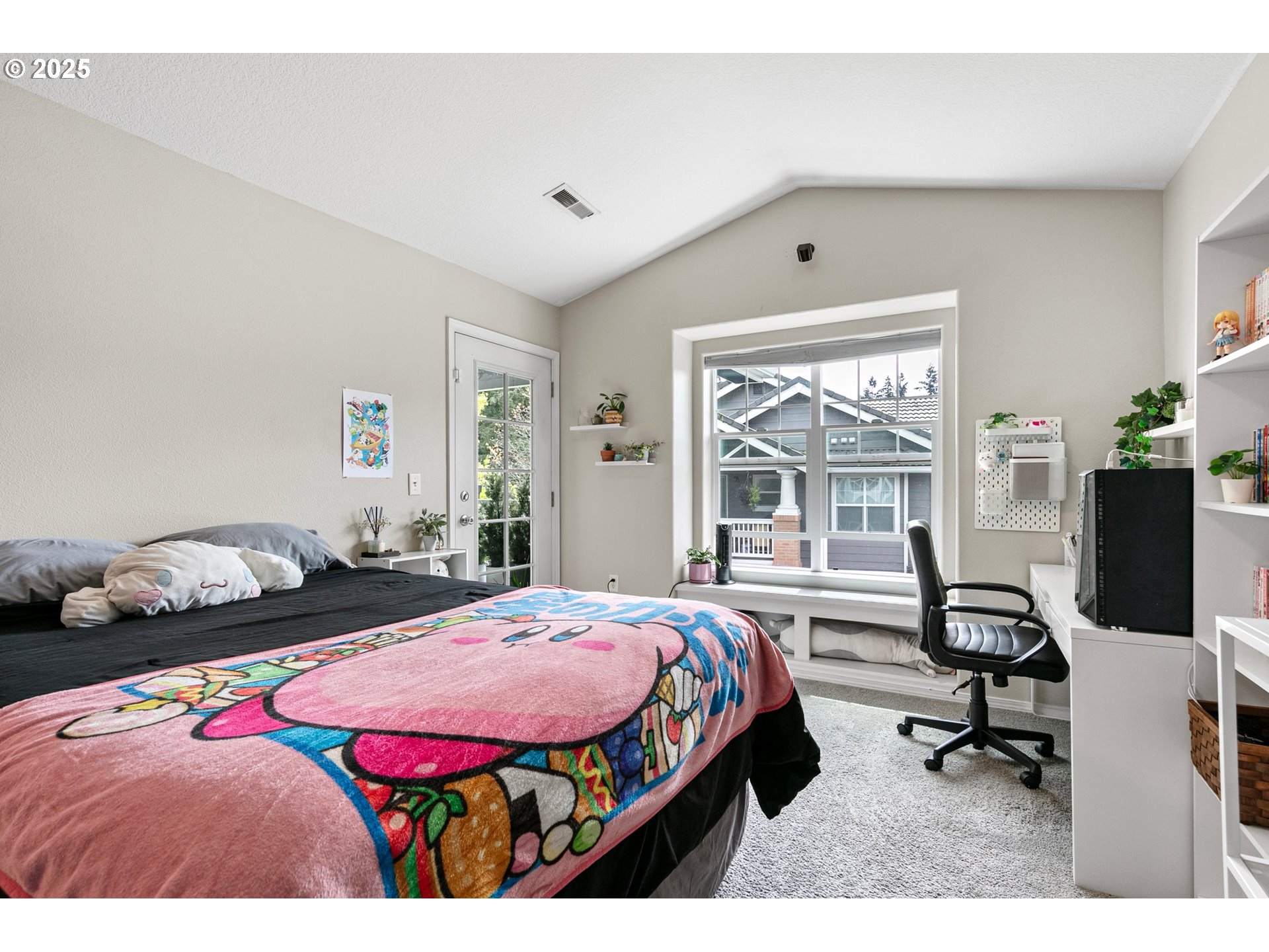 30366 Southwest Ruth Street, Unit 70 Wilsonville, OR 97070 - Photo 33 of 46 a bedroom with a bed and a large window