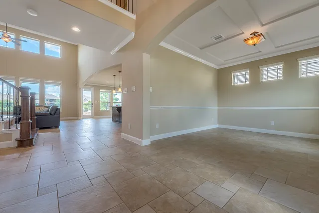a view of a hallway with wooden floor windows and livingroom