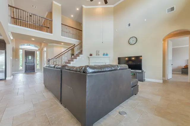 a kitchen with stainless steel appliances granite countertop a sink and a refrigerator