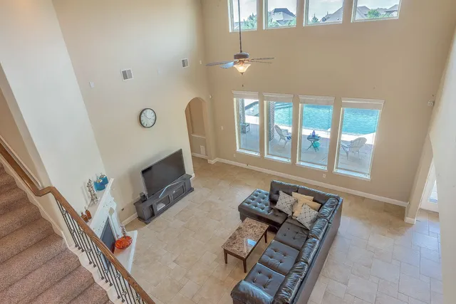 a view of an empty room with closet and a window