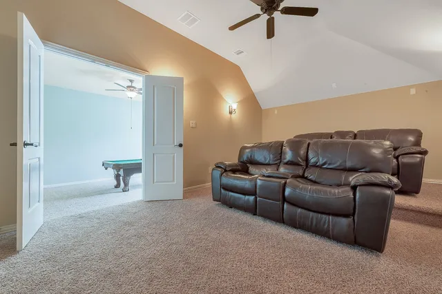 a bathroom with a granite countertop sink toilet mirror and shower