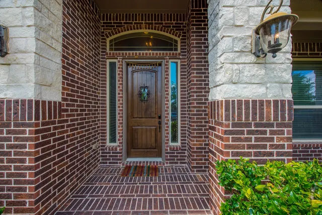 a view of a brick house with a door