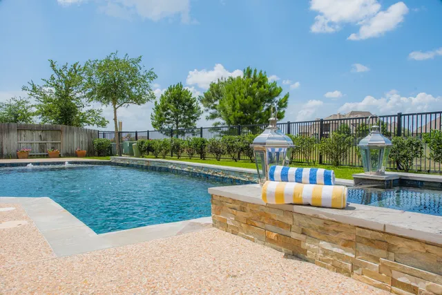 a view of a swimming pool with a patio