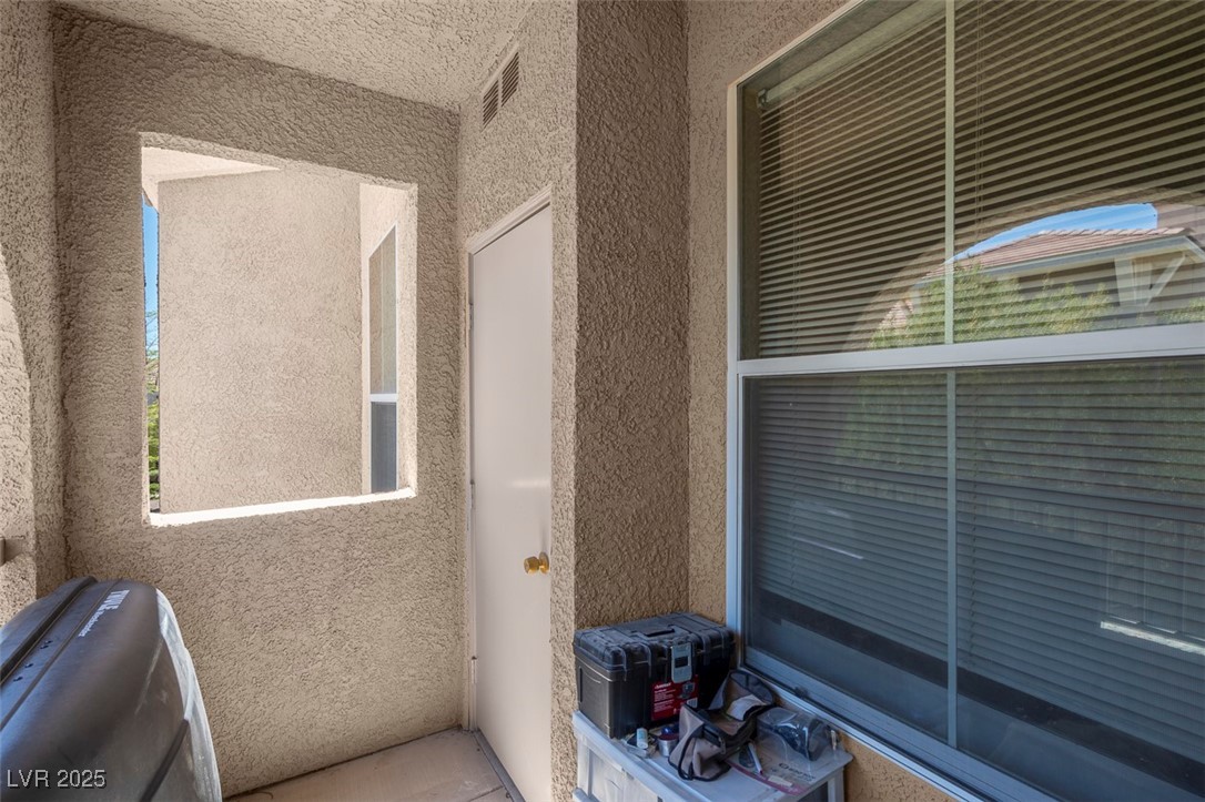 10550 West Alexander Road, Unit 2210 Las Vegas, NV 89129 - Photo 19 of 29 Details featuring visible vents and stucco siding