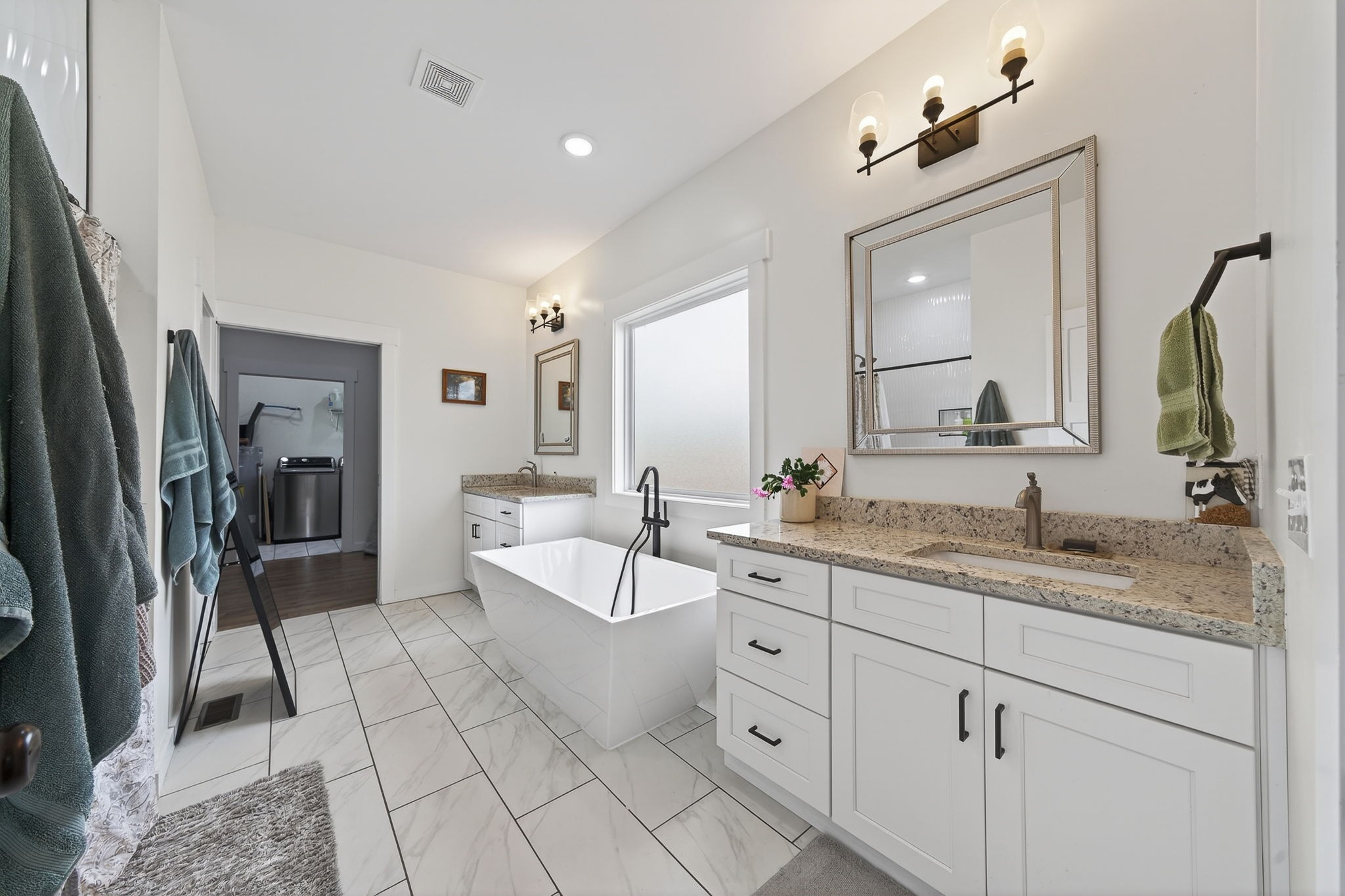 652 Clog Valley Road Sparta, TN 38583 - Photo 15 of 38 a spacious en suite bathroom with a granite countertop sink mirror and bathtub