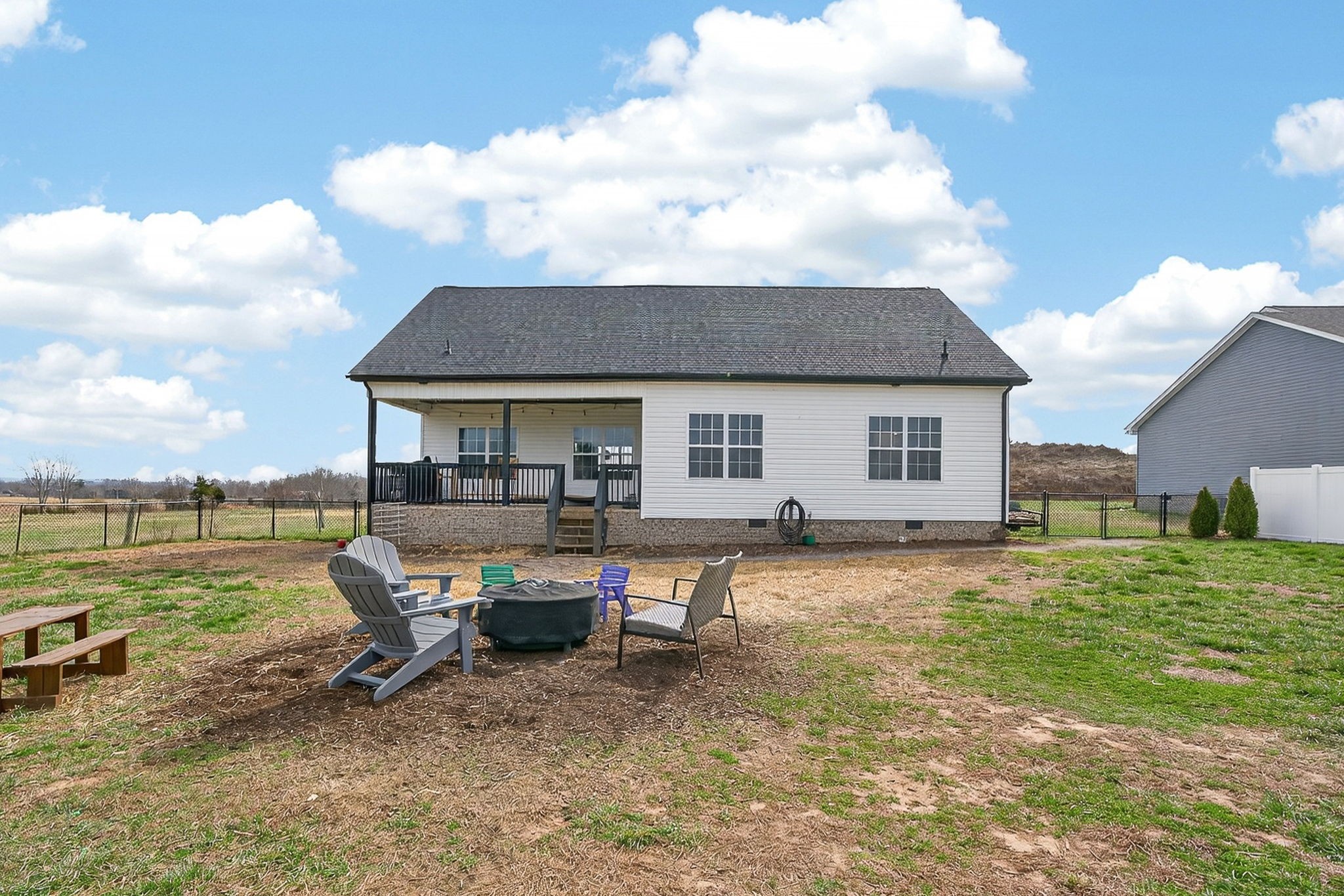 652 Clog Valley Road Sparta, TN 38583 - Photo 29 of 38 a backyard of a house with table and chairs