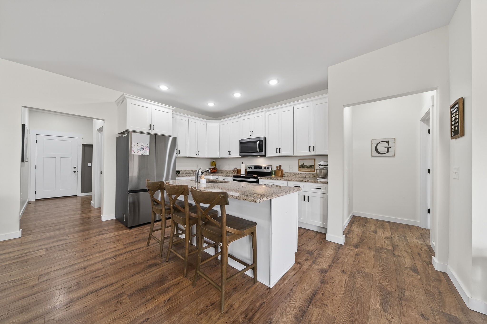 652 Clog Valley Road Sparta, TN 38583 - Photo 5 of 38 a kitchen with stainless steel appliances a refrigerator a stove a sink dishwasher and a oven with wooden floor