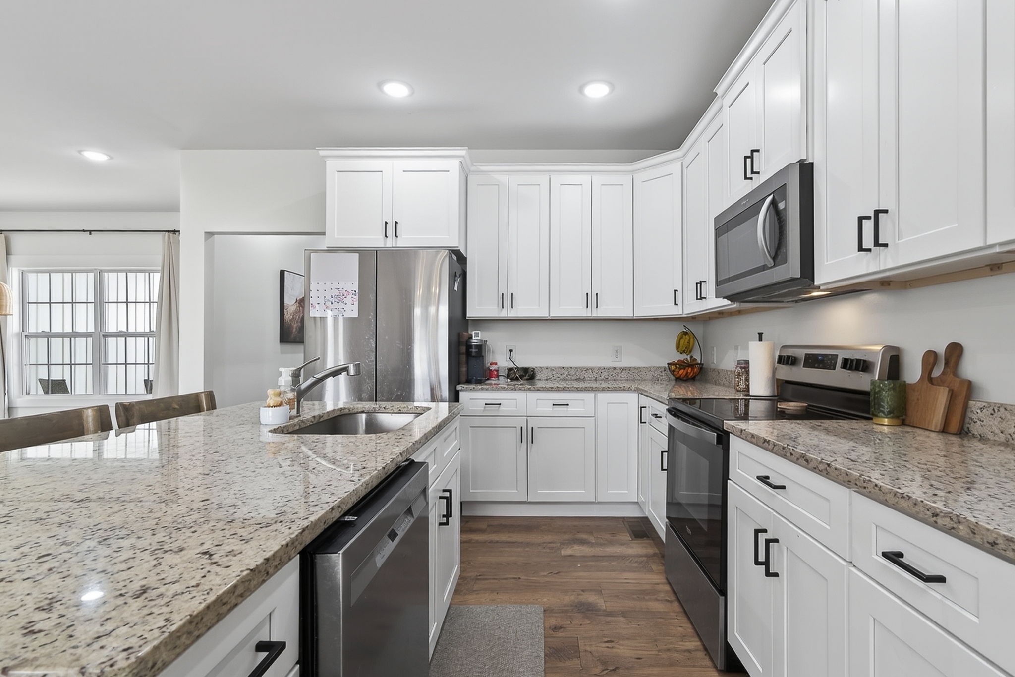 652 Clog Valley Road Sparta, TN 38583 - Photo 8 of 38 a kitchen with stainless steel appliances granite countertop a sink stove and refrigerator