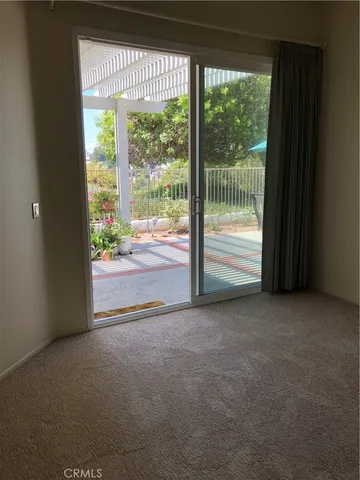 a view of a room with large windows
