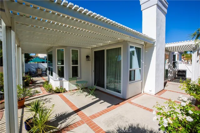 a bedroom with a bed and a potted plant
