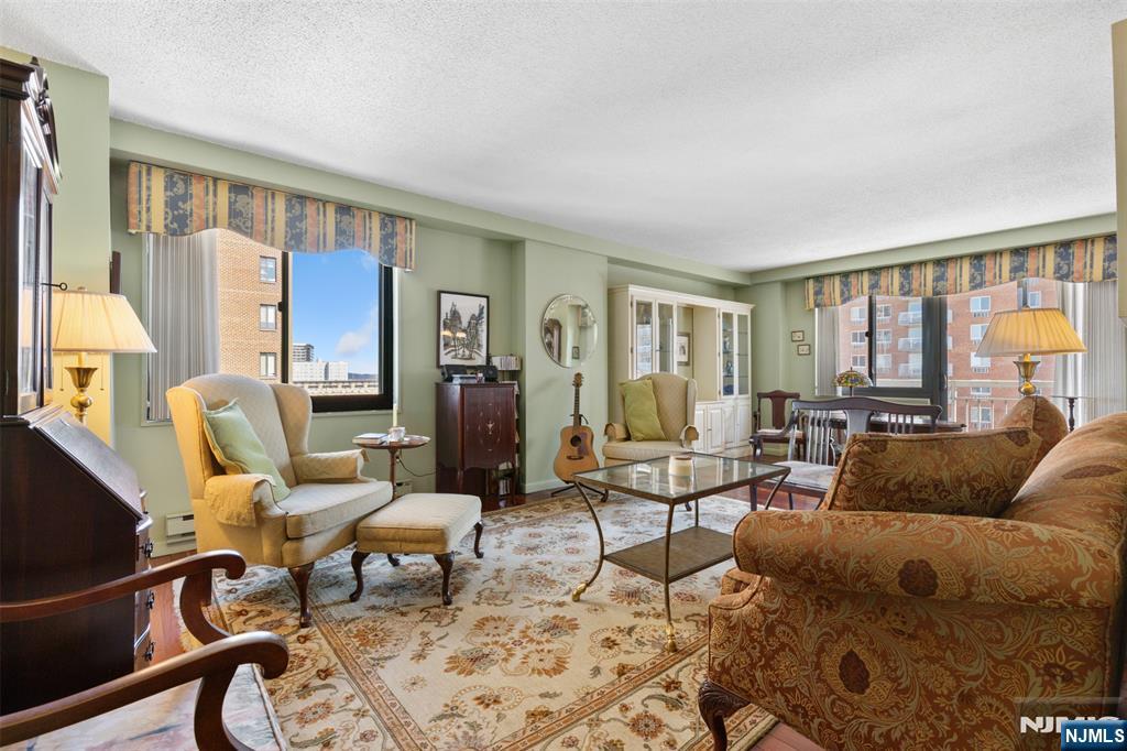 151 Prospect Avenue, Unit 9D Hackensack, NJ 07601 - Photo 2 of 38 a living room with furniture and a window