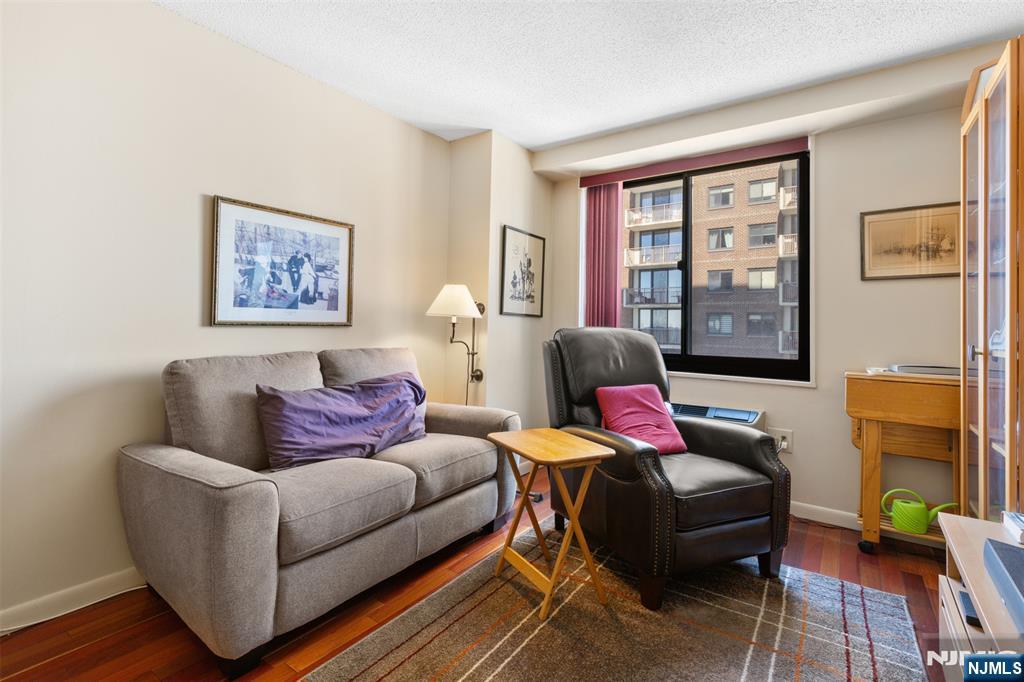 151 Prospect Avenue, Unit 9D Hackensack, NJ 07601 - Photo 21 of 38 a living room with furniture and a window