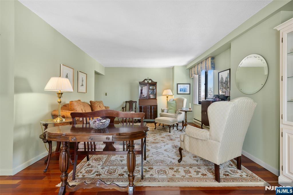 151 Prospect Avenue, Unit 9D Hackensack, NJ 07601 - Photo 3 of 38 a living room with furniture a rug and a window