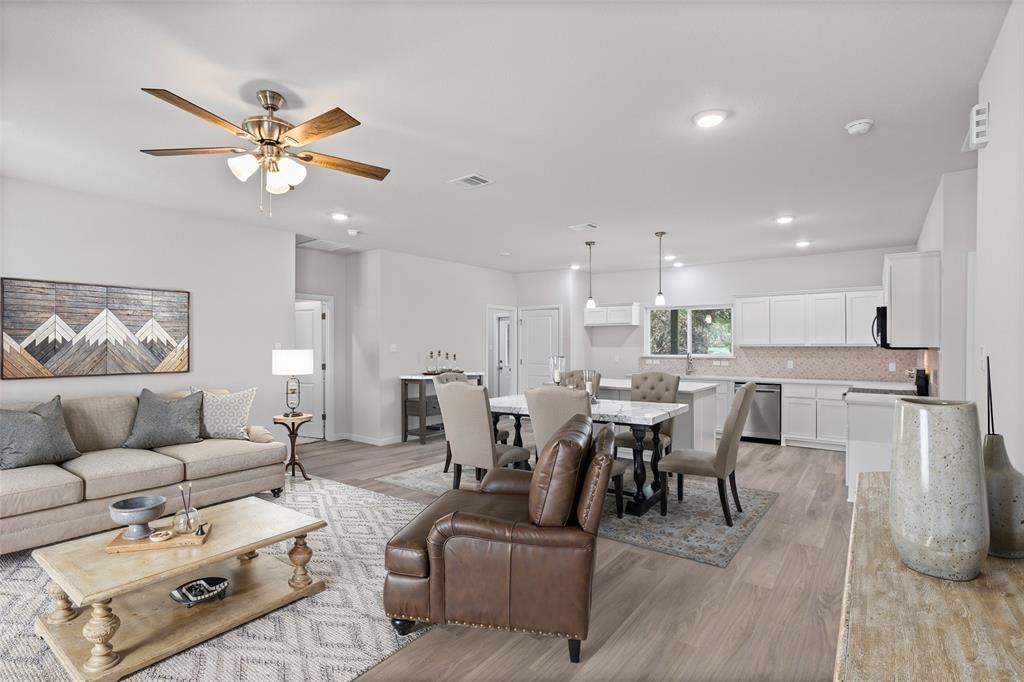 9320 Apache Trail Rio Vista, TX 76093 - Photo 14 of 33 a living room with furniture kitchen view and a chandelier