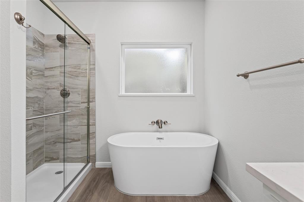 9320 Apache Trail Rio Vista, TX 76093 - Photo 25 of 33 a white bath tub sitting next to a shower