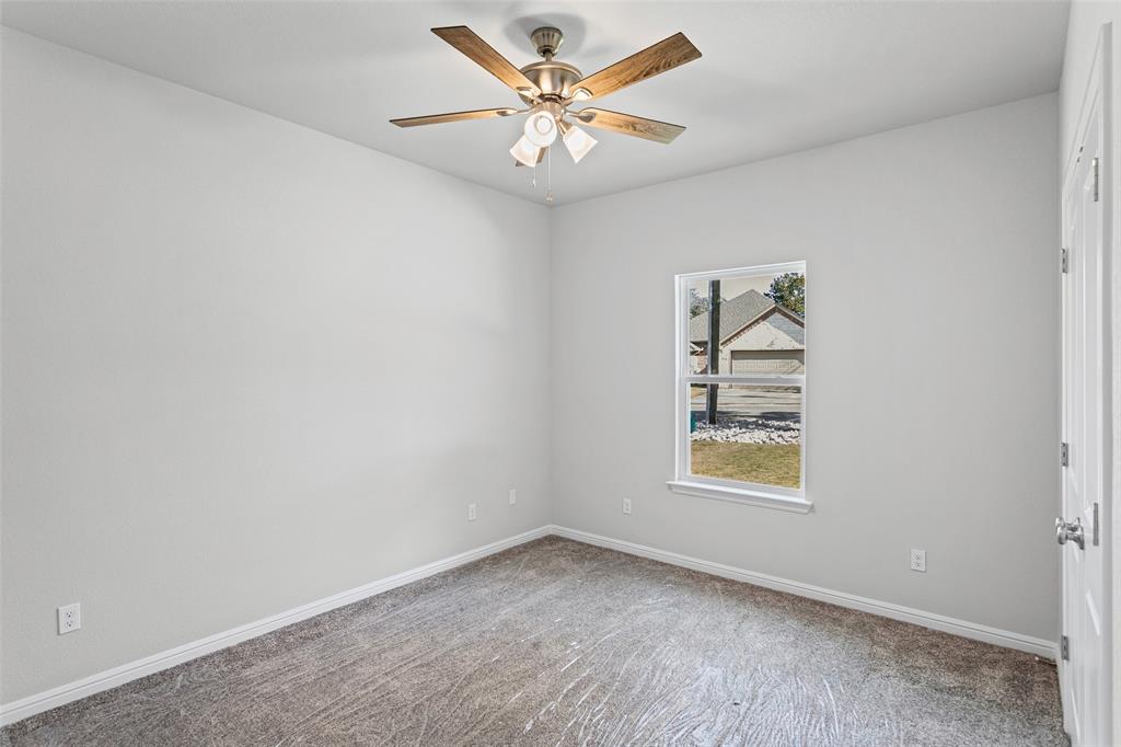 9320 Apache Trail Rio Vista, TX 76093 - Photo 28 of 33 an empty room with windows and fan