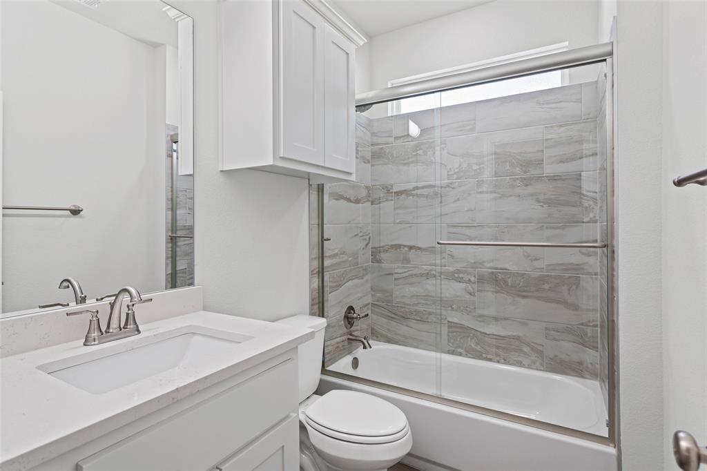 9320 Apache Trail Rio Vista, TX 76093 - Photo 30 of 33 a bathroom with a sink toilet and shower
