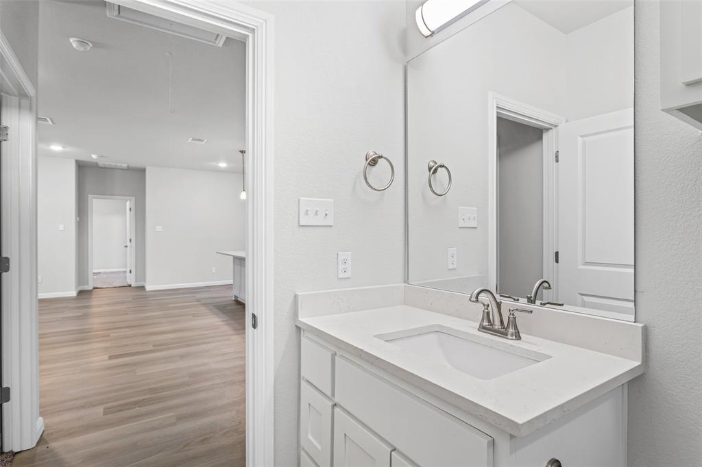 9320 Apache Trail Rio Vista, TX 76093 - Photo 31 of 33 a bathroom with a sink and a mirror