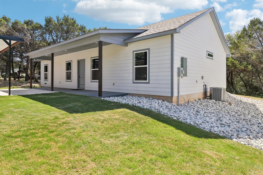 9320 Apache Trail Rio Vista, TX 76093 - Photo 5 of 33 a view of a house with swimming pool