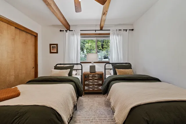 a bedroom with a bed and a couch