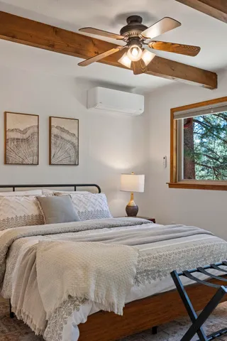 a bedroom with a bed and a table