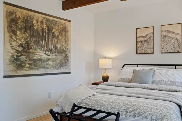 a bathroom with a shower a sink and a mirror