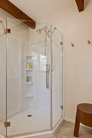 a bathroom with a granite countertop sink a window and a mirror