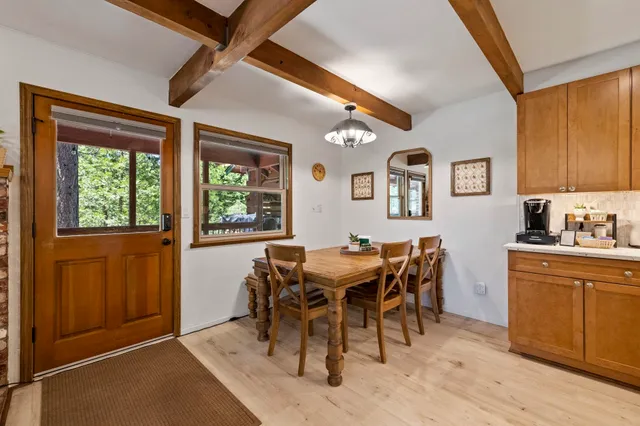 a view of a dining room with furniture and window