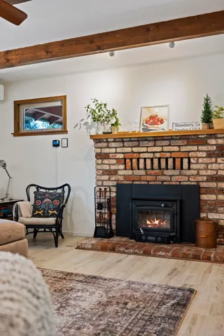 a view of a dining room with furniture and a chandelier