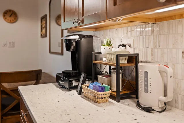 a view of a roof deck with wooden floor and outdoor seating