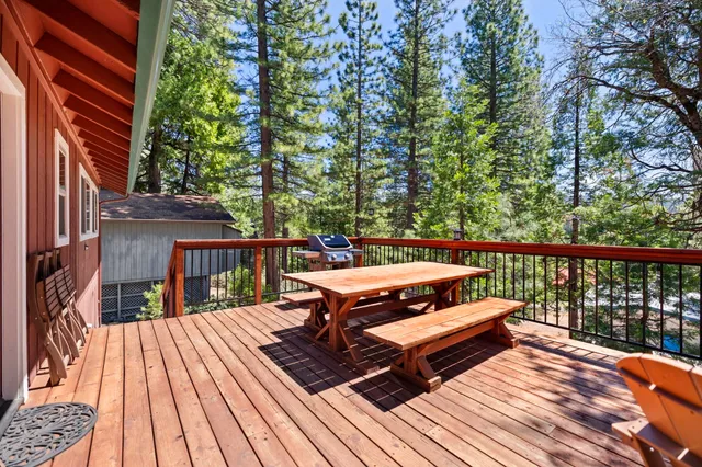 a balcony with furniture and wooden floor