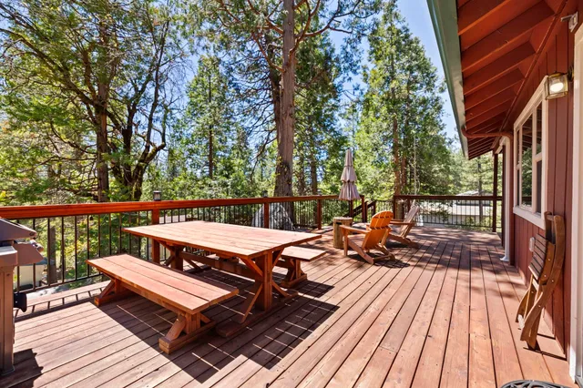 a view of a two chairs and table in the balcony