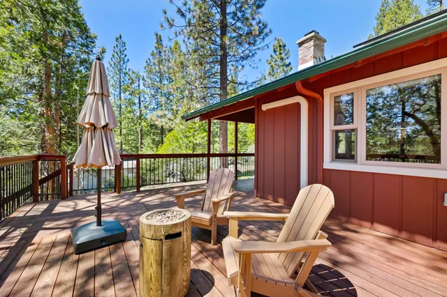 a view of balcony with wooden floor and fence
