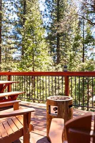 a view of backyard with a deck and wooden floor
