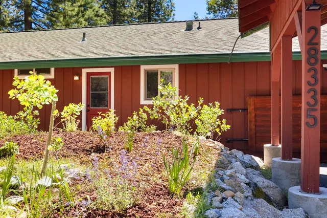 a view of a large mountain with a mountain in the background